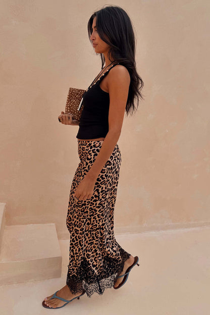 Leopard Lace Midi Maeva Skirt with a black lace border, styled with a black tank top and kitten heels.
