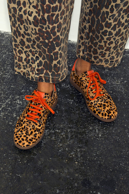 Leopard Pony Trainer in premium leather with leopard print, orange laces and matching trousers.