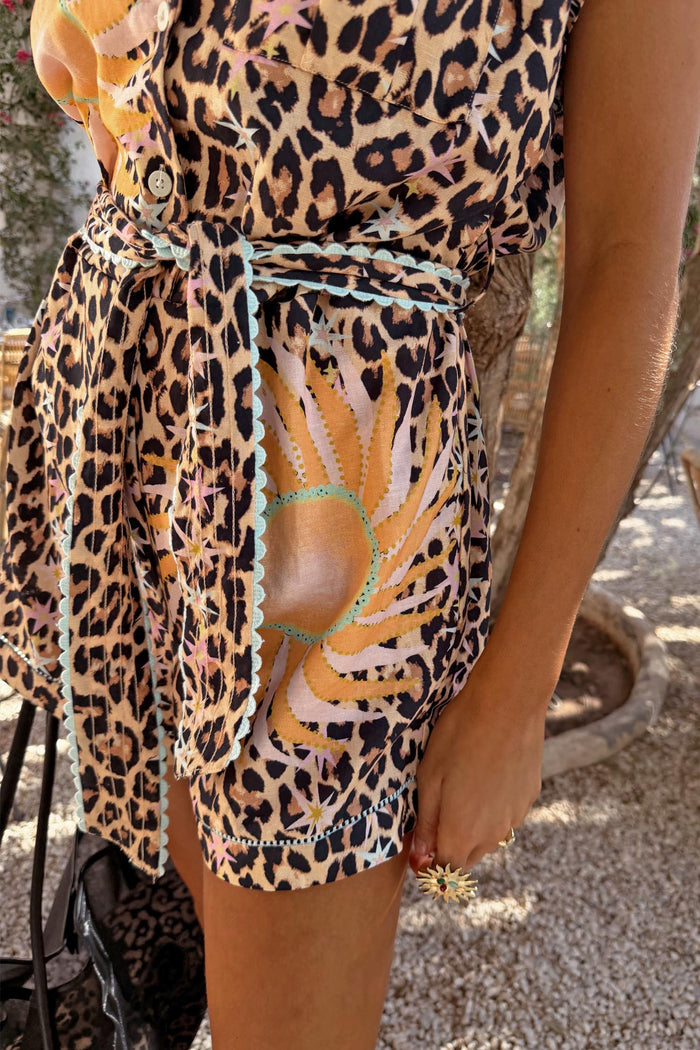 Leopard Print Playsuit featuring a soleil sun print, contrast turquoise trim and a matching waist tie.