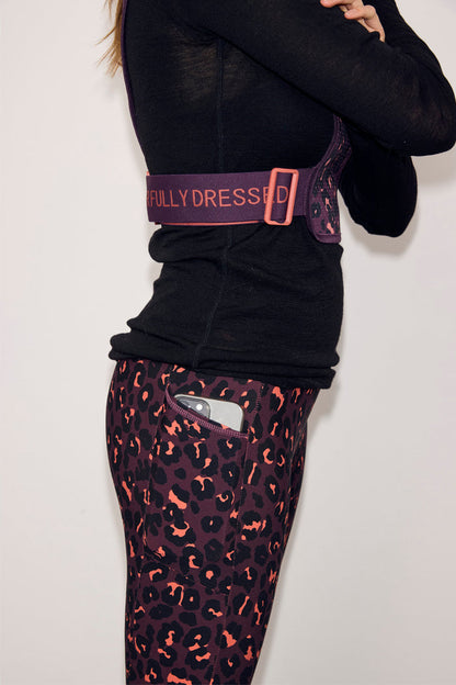 Leopard Running Bag in dark plum leopard print with Never Fully Dressed branded straps and matching leggings.