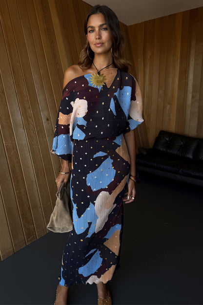 Mara Abstract Tilly Dress in plisse fabric with a brown abstract print, gold metallic flecks and a voluminous top.