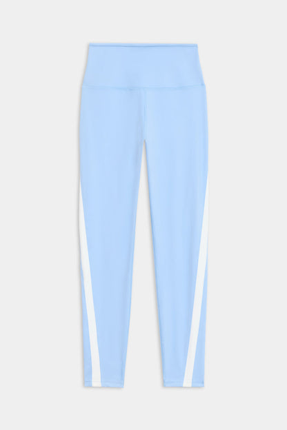 The Miles High Waist Rigor 7/8 leggings by SPLITS59 are light blue with a high waistband and white vertical side stripes, displayed flat against a white background.