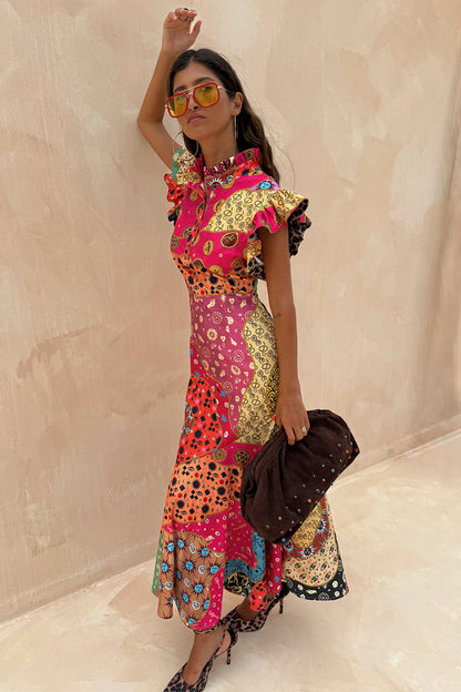 Morocco Remi Dress featuring an abstract patchwork print, pleated frill neckline and ruffled sleeves.