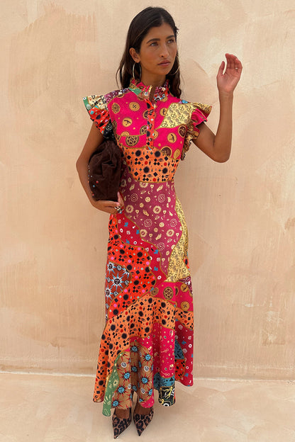 Morocco Remi Dress featuring a multi-colour abstract patchwork print, pleated frill neckline, and a-symmetrical skirt.