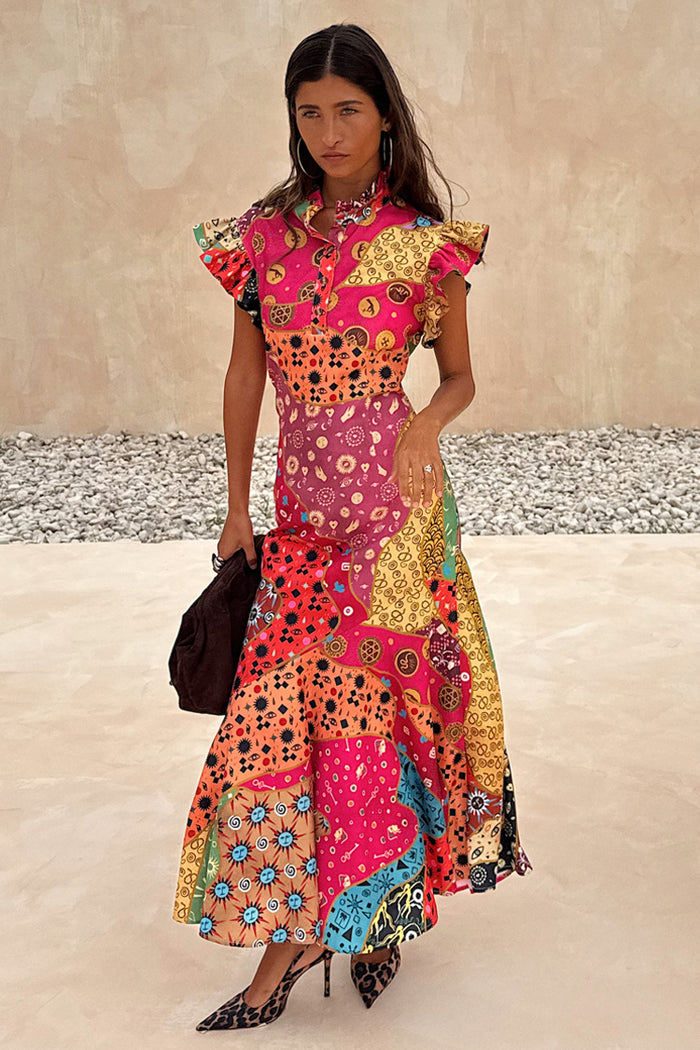 Morocco Remi Dress in a multi-coloured patchwork abstract print with pleated frills and an asymmetrical midi skirt.
