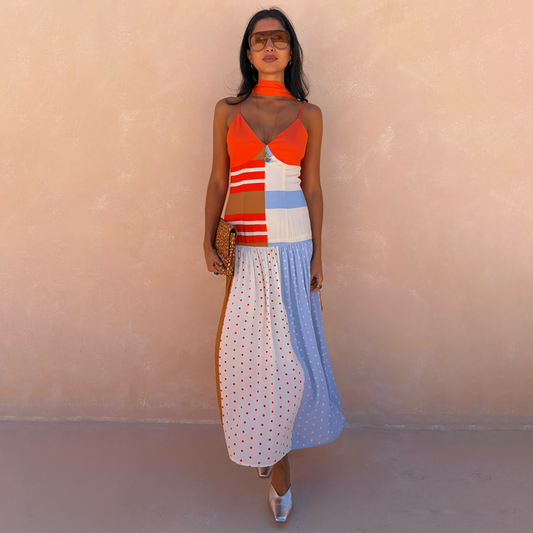 Multi Stripe Bea Dress in an orange and blue colourway with a pleated polka dot skirt and matching neck scarf.