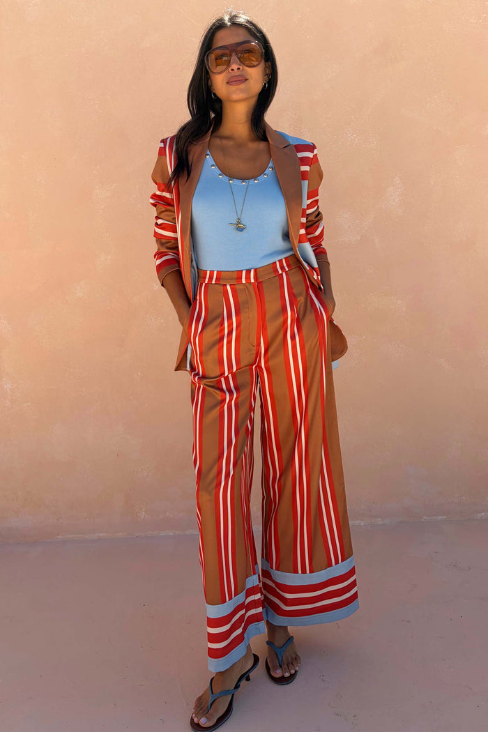 Satin-esque Multi Stripe Marnie Trousers with bold red and blue stripes, styled in a wide-leg fit with a blazer.