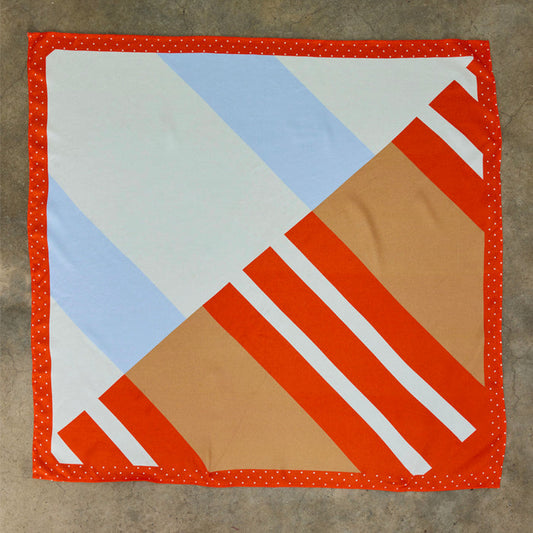 Multi Stripe Mix Bandana with orange and blue stripes and a red polka dot border, a multi-wear piece designed in London.