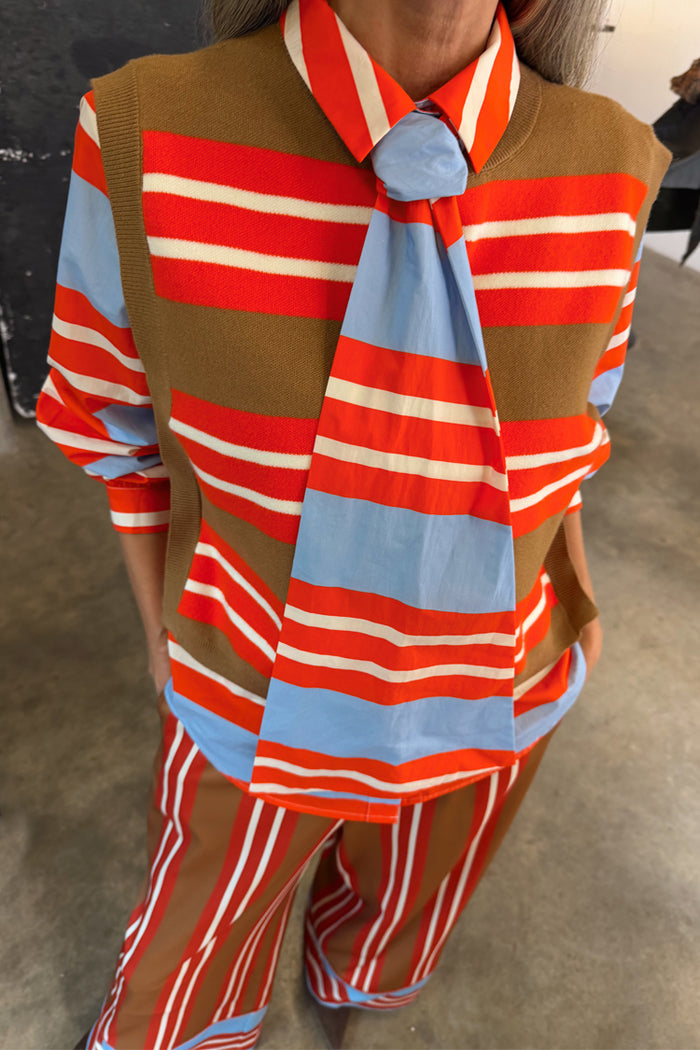 Multi Stripe Tank Top in tan and red knit, layered over a striped shirt for feel good dressing.