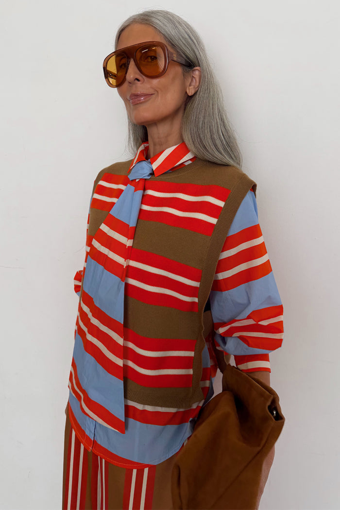 Multi Stripe Tank Top in tan and red soft touch knit, layered over a striped shirt for a London look.