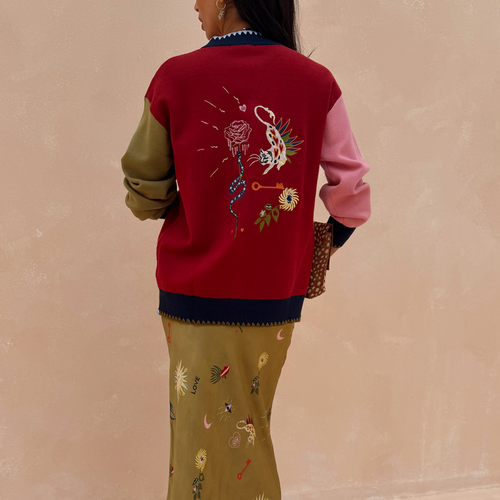 Mystical Martha Cardigan with embroidered back motifs, multicoloured sleeves and contrast blanket stitching.