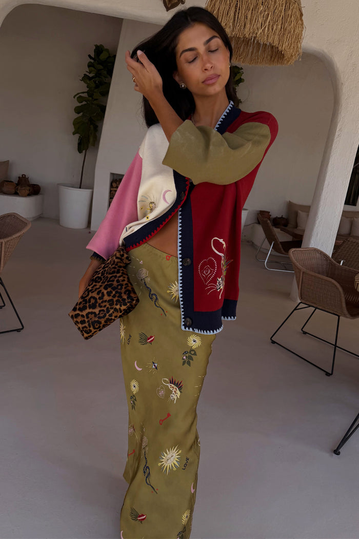 Mystical Martha Cardigan in a multicoloured knit with embroidered motifs, styled with a printed olive maxi skirt.