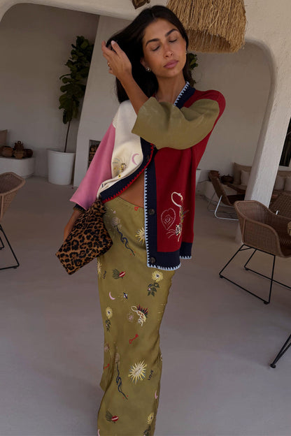 Mystical Martha Cardigan in a multicoloured knit with embroidered motifs, styled with a printed olive maxi skirt.