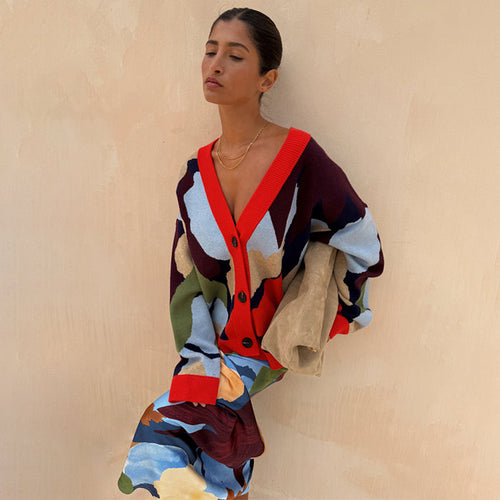 Navy Abstract Callie Cardigan featuring a bold artist print and red ribbed trims, styled with a matching skirt.