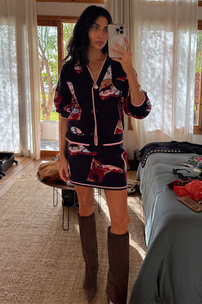 Navy Cowboy Boots Jake knit mini skirt featuring pink contrast trim and cowboy motifs, styled as a matching co-ord.