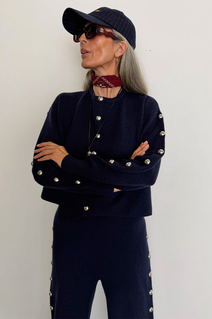 Navy Blue Studded Cardigan with silver stud detailing, styled as a knit co-ord for a London look.