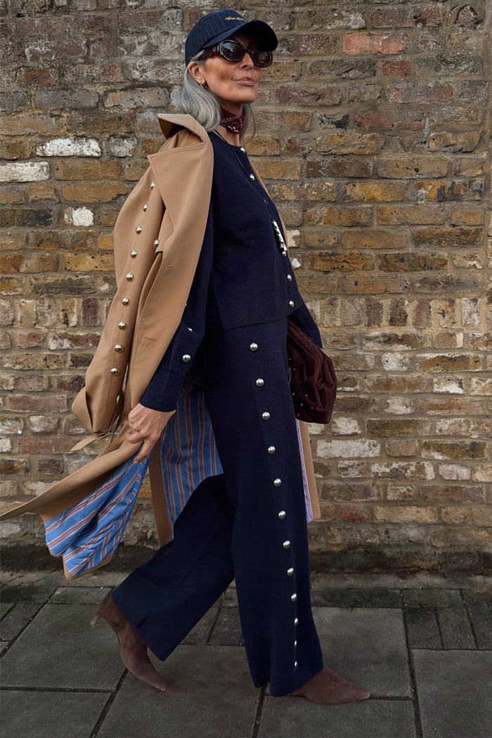 Navy Studded Knit Jogger co-ord with silver stud details, layered under a tan trench coat.
