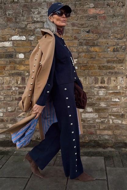 Navy Studded Knit Jogger co-ord with silver stud details, layered under a tan trench coat.
