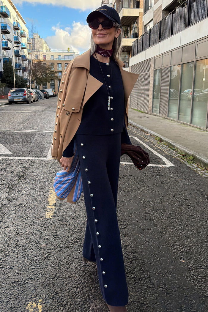 Navy Studded Knit Jogger with silver stud details, styled as a co-ord with a camel trench for a London street look.