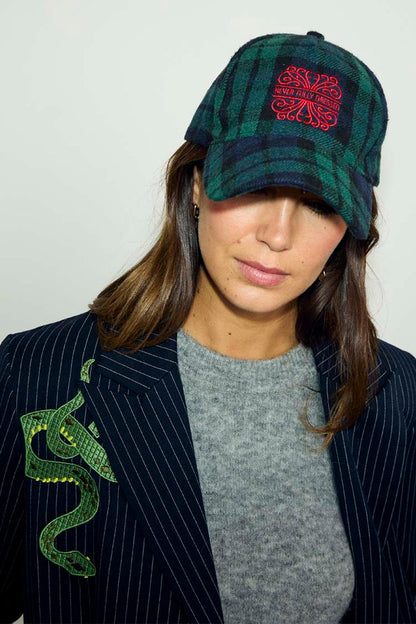 Navy Tartan NFD Cap in blue and green with red embroidered logo, styled with a grey knit and pinstripe blazer.