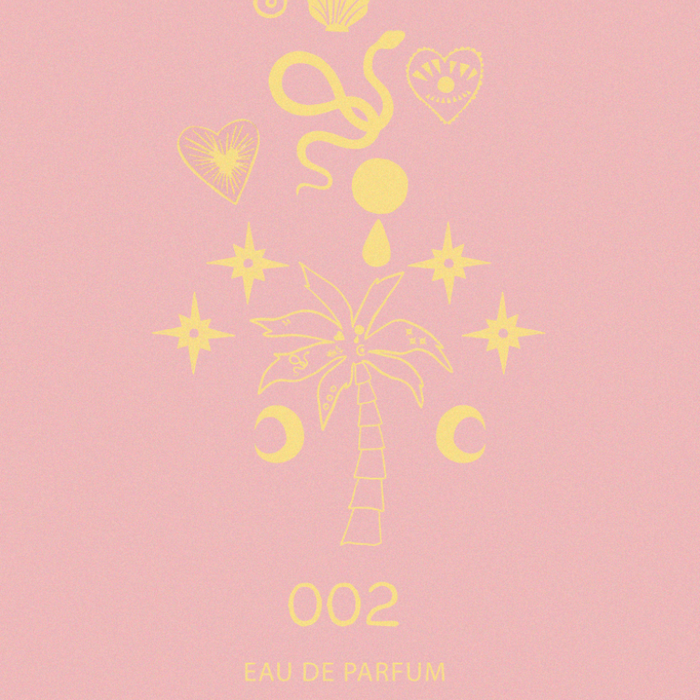 NFD Eau De Parfum 002 graphic print in pink and yellow featuring a central palm tree, crescent moons and celestial stars.