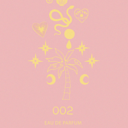 NFD Eau De Parfum 002 graphic print in pink and yellow featuring a central palm tree, crescent moons and celestial stars.