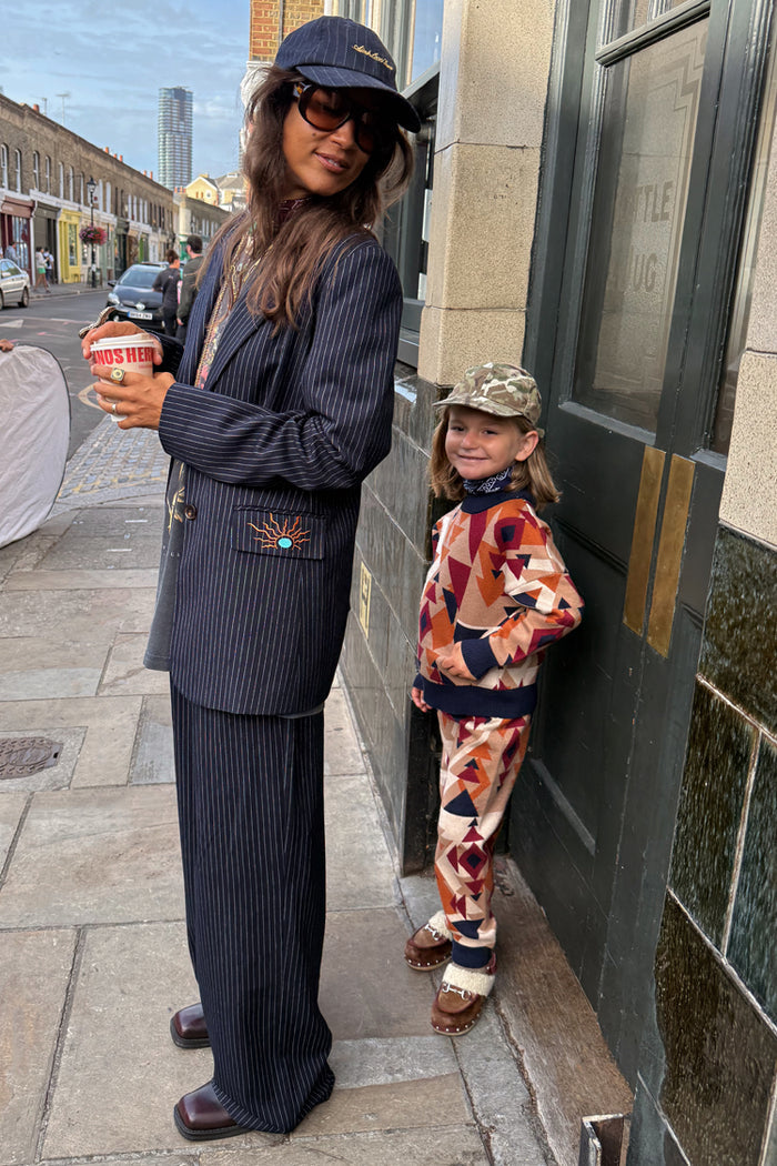 NFD Kids Aspen Jogger and matching knitted jumper with a geometric print on a child in London.