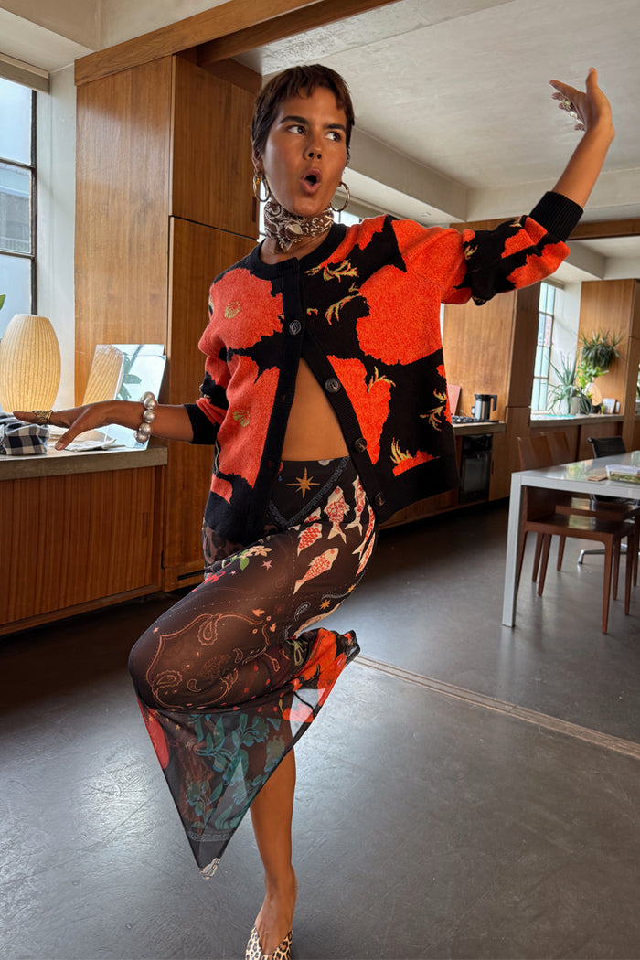 Night Garden Mesh Dorris Skirt featuring mystical motifs in mesh, styled with a red and black floral cardigan.