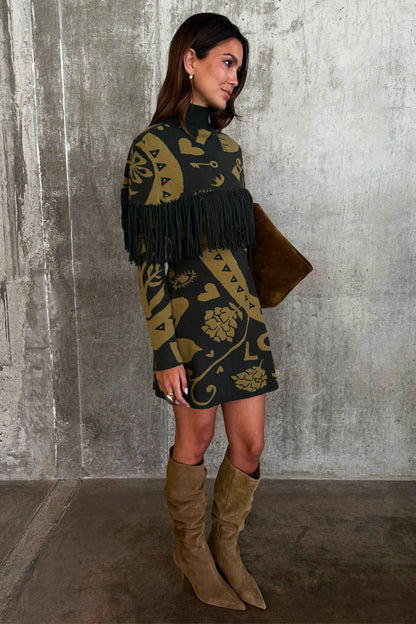 Olive Amara Knit Mini Dress with iconic gold motifs and statement fringe, worn by a 5ft7” model who wears size M.