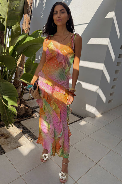 Multi-coloured Ombre Jacquard Faro Dress with tiered ruffles and silver embellishment on a model for a vacation look.