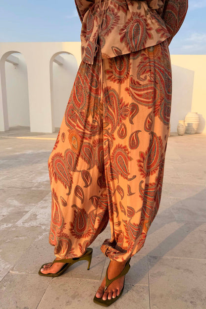 Peach Paisley Balloon Trousers with a breathable balloon silhouette, styled as a summer co-ord with matching top.