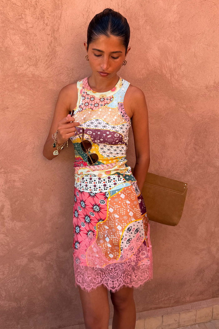 Pastel Morocco Mini Maeva Skirt featuring a pink lace trim and abstract motifs, styled with a matching tank top.