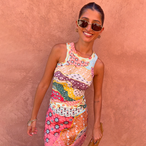Pastel Morocco Rib Tank Top with abstract sun and eye motifs in a soft ribbed fabric, styled on a model outdoors.