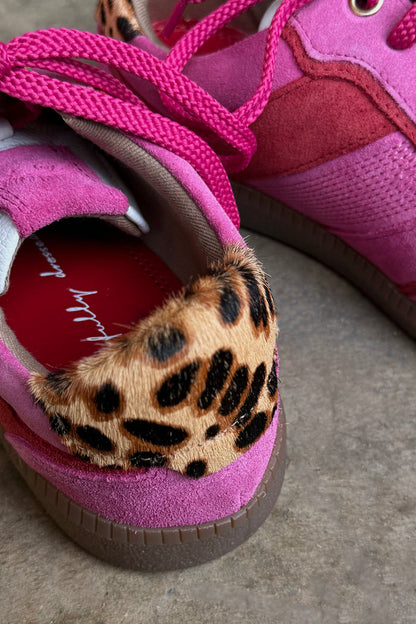 Pink and Red Leather Trainer detail featuring a leopard print heel tab and soft pink suede upper.