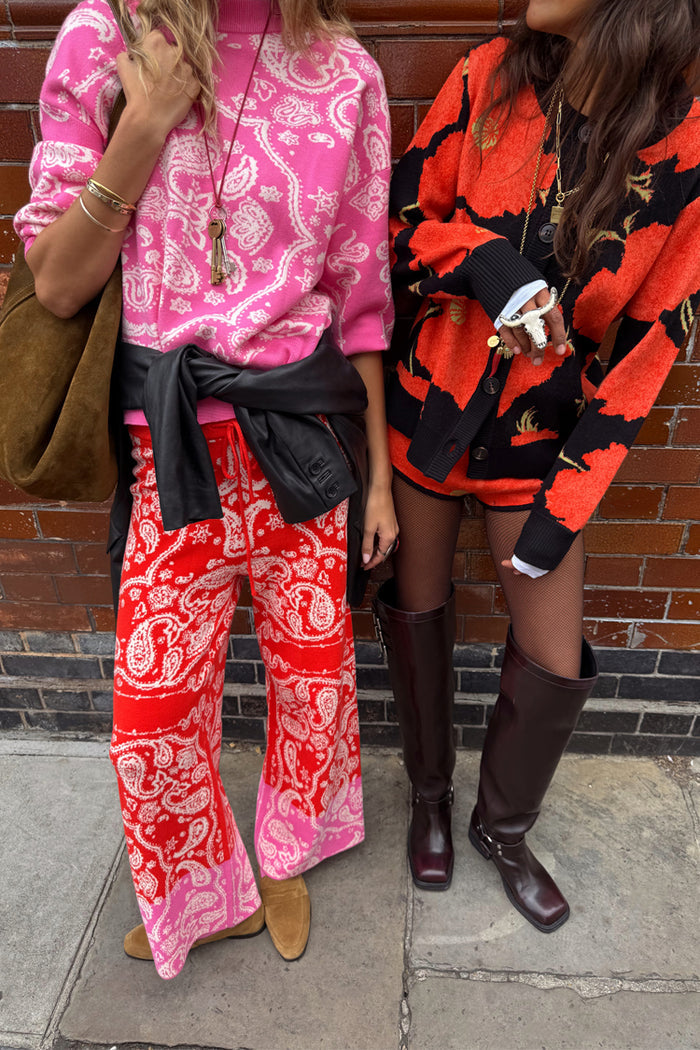 Pink Bandana Copenhagen Jumper and matching red joggers in a knit bandana print, styled for a London look.