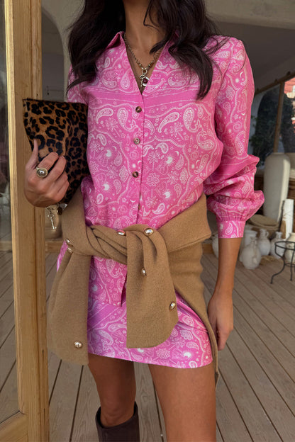 Pink Bandana Mini Dorris Skirt and matching shirt in a paisley print styled with a tan cardigan and leopard clutch.