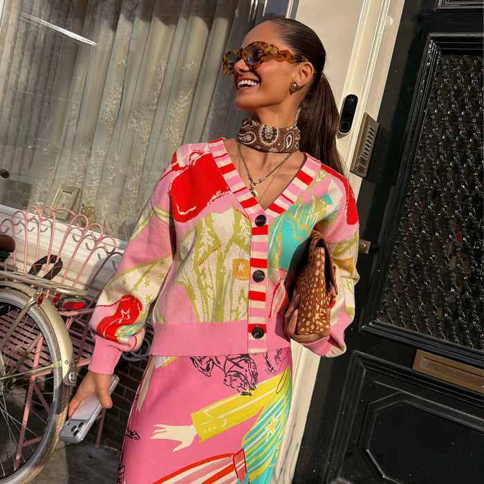Pink Dallas Cardigan featuring abstract cowgirl motifs and a striped button stand, styled with a matching print skirt.