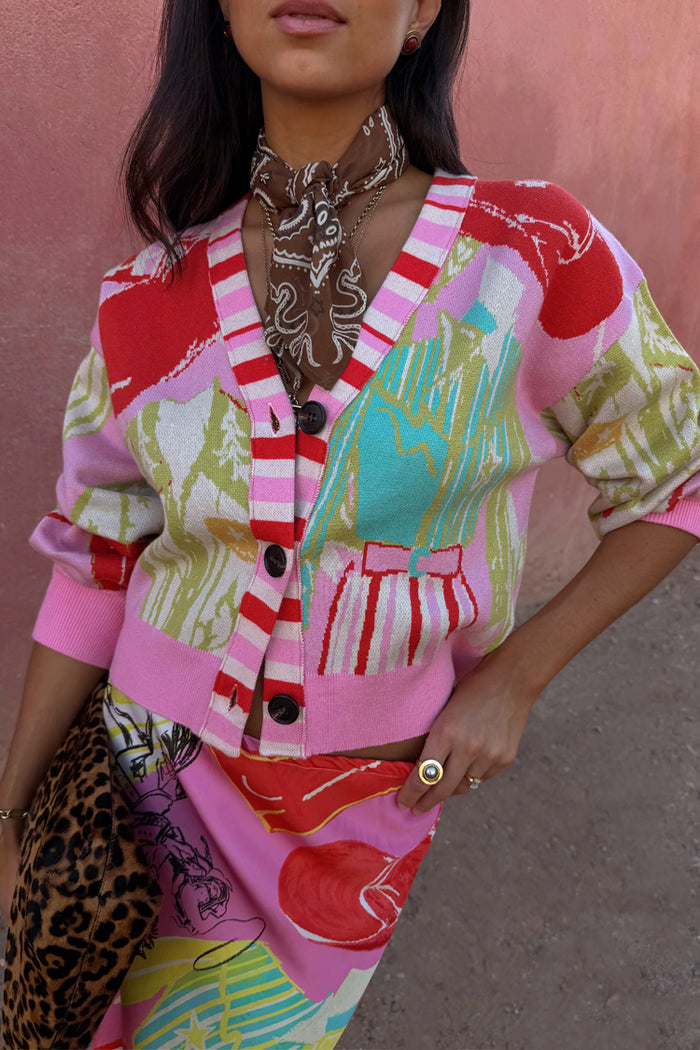 Pink Dallas Cardigan featuring abstract cowboy motifs, a striped button stand and soft-touch knit.
