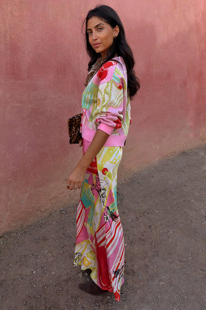Pink Dallas Dorris Skirt featuring an in-house abstract cowboy print, styled with a matching cardigan.