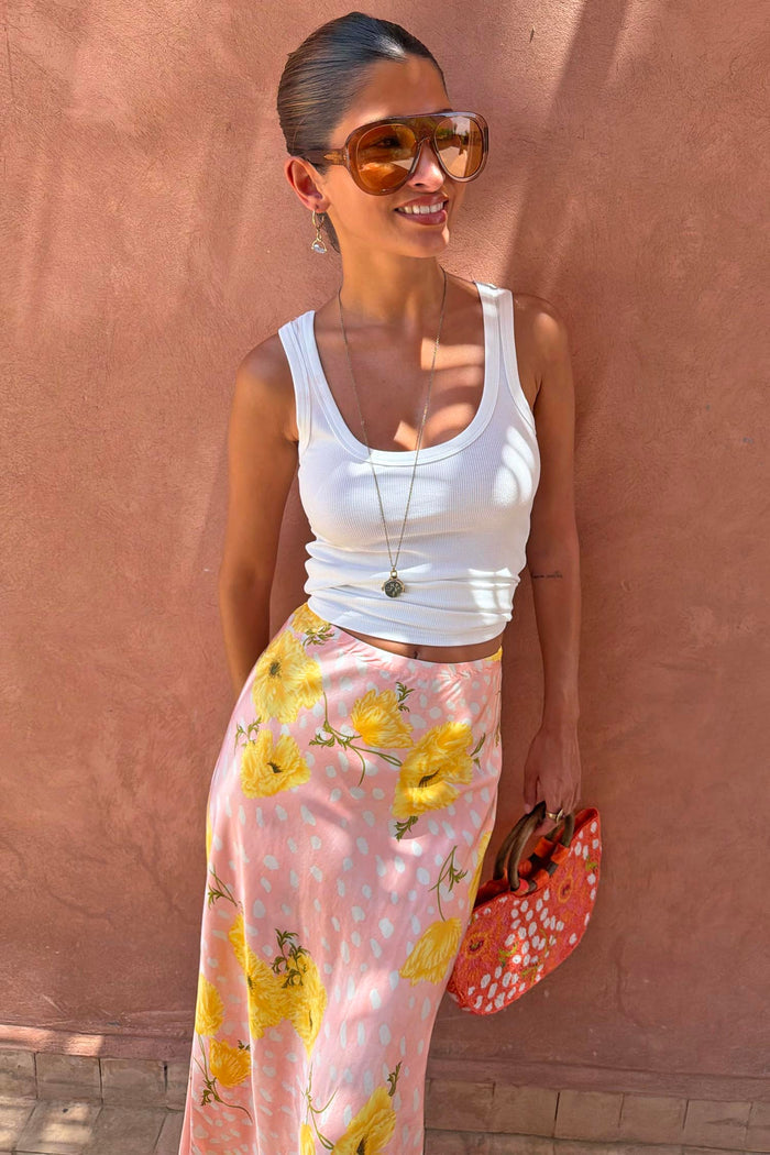 Pink Fawn Poppy Maeva Petite Midi Skirt with yellow poppy motifs and deer print, paired with a white tank.