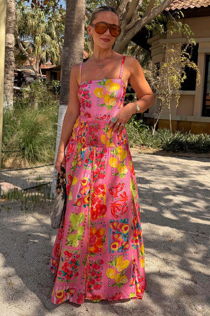 Pink Fruit Stamps Bandeau Swimsuit with a Mediterranean fruit print, styled with a matching maxi skirt.