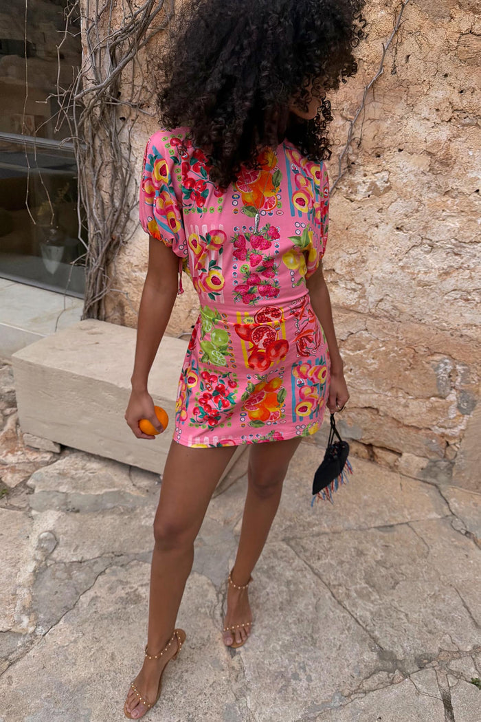 Pink Fruit Stamps Mini Dress featuring a vibrant fruit print, short sleeves and a classic t-shirt fit.