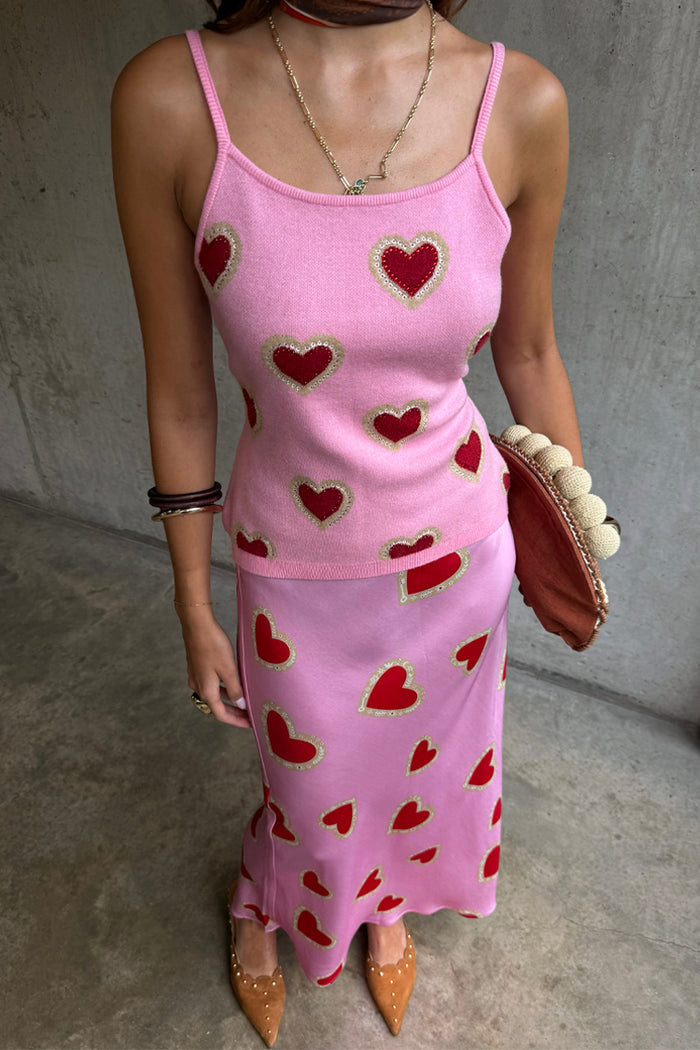 Pink Hearts Knit Tank featuring a red heart print on a pink base, styled as a co-ord with a matching skirt.