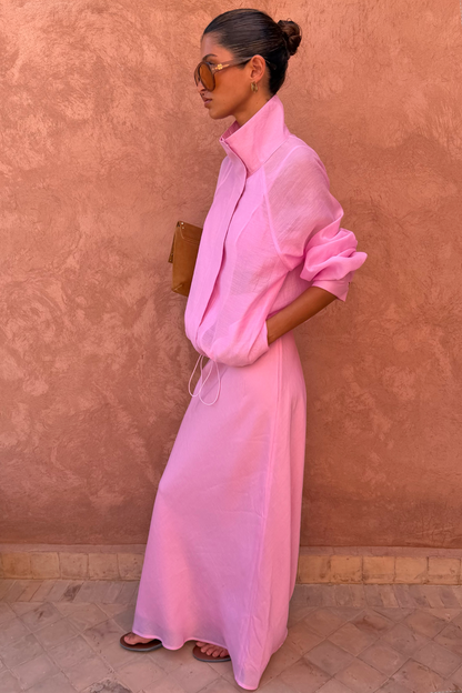 Sheer Pink Organza Funnel Jacket and matching maxi skirt styled against a textured terracotta wall.
