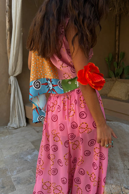 Pink Snake Balloon Trouser in dusky pink with snake and swirl motifs and a lightweight balloon silhouette.