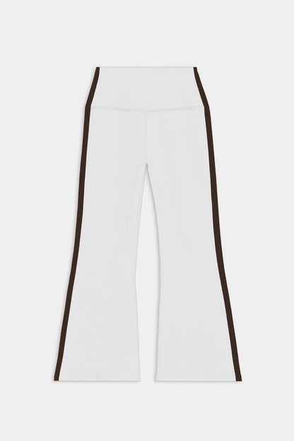 SPLITS59 Raquel High Waist Supplex Crop in White/Dark Chocolate: white, high-waisted, flared pants with dark chocolate side stripes, made from 4-way stretch supplex for yoga-like comfort. Displayed flat on a plain background.