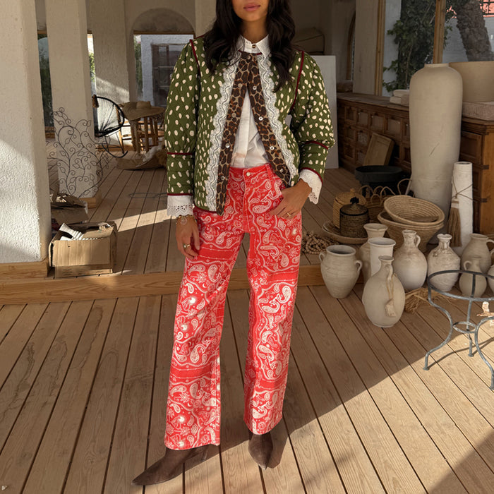 Red Bandana Jeans in a straight leg fit with a white paisley print, paired with a green quilted jacket.