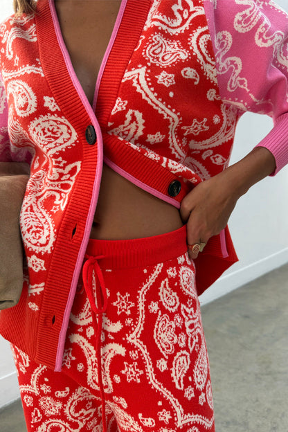 Red Bandana Martha Cardigan in a soft knit with pink trim, paired with matching red and pink joggers.