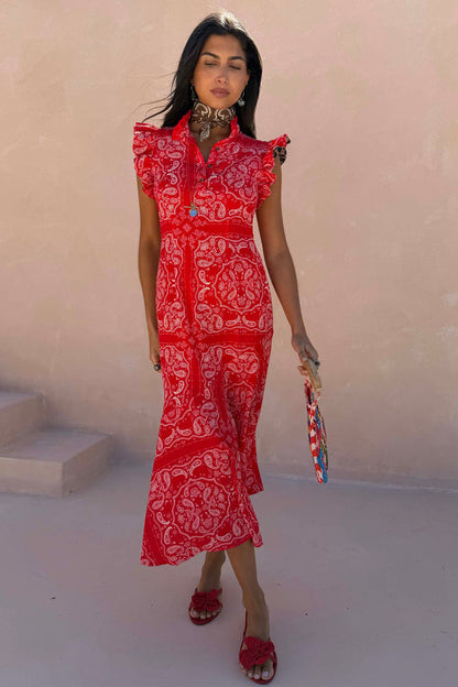 NFD Red Bandana Remi Dress with leopard sleeves and a frilled neckline, styled with a neck scarf and red floral sandals.