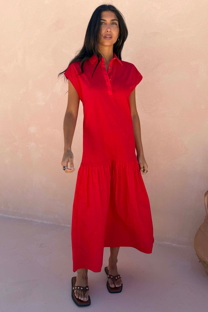 Red Darcy Cotton Midi Dress with a dropped waist and cap sleeves, designed in London and shown on a model.